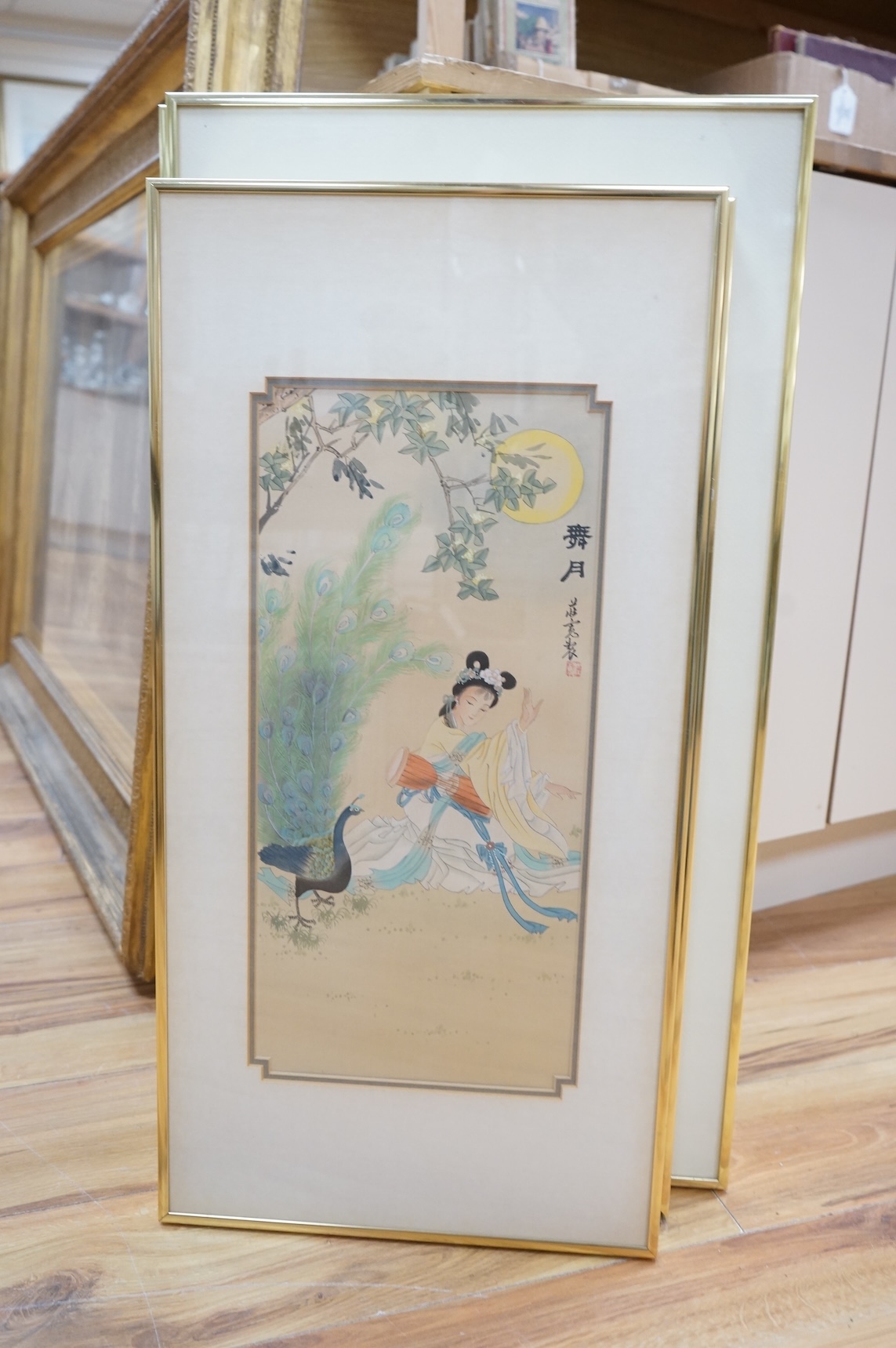 Chinese school, set of four watercolours, Geisha girls before trees and flowers, each signed with character marks and red seal mark, largest 59 x 28cm